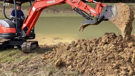 digging a pond with a mini excavator|digging a pond on tractor.